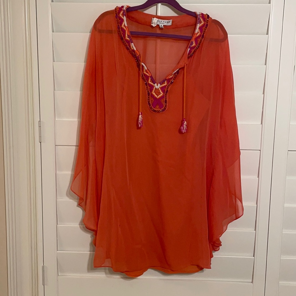 Trina Turk orange dress with embroidery and beading at neck line